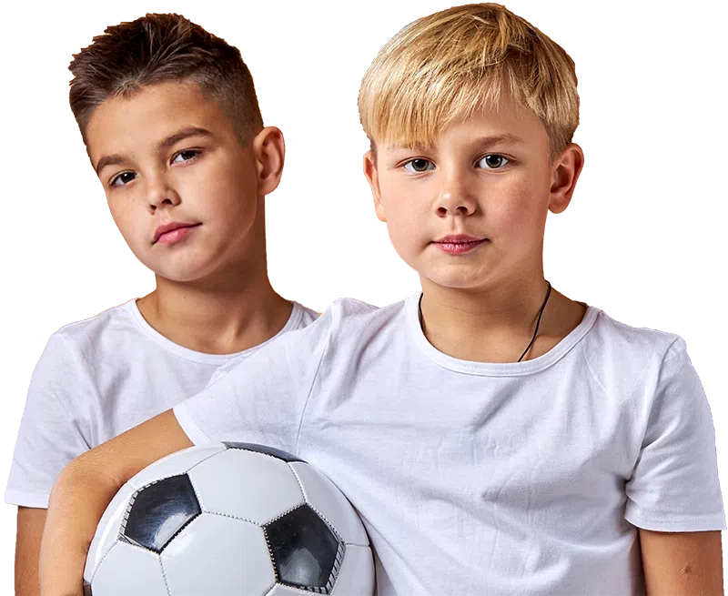 Two boys, one holding a soccer ball, representing the opportunities provided through donations to Playground Stars for local youth sports.