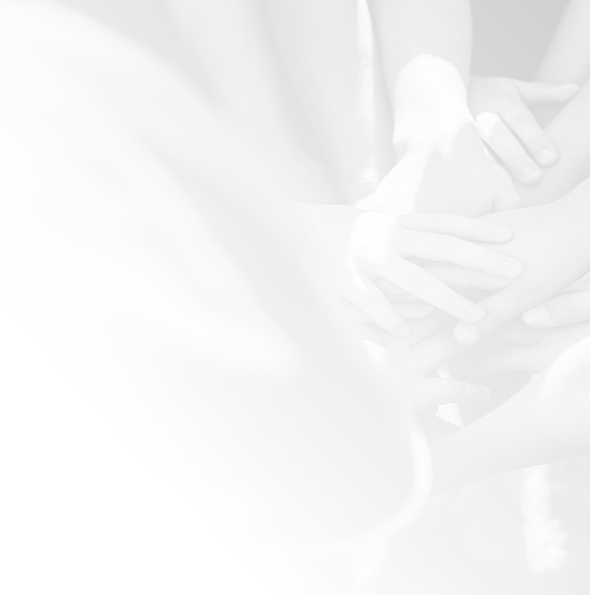Hands joining together in a team huddle, representing inclusive youth sports.